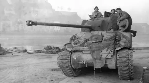 The British 29th Armoured Brigade in Namur, patrolling the Meuse river