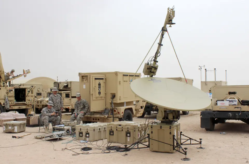 Soldiers of the 40th Expeditionary Signal Battalion test a satellite communications (SATCOM) terminal