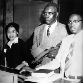 Army veteran E.D. Nixon assisting Rosa Parks with her bail.